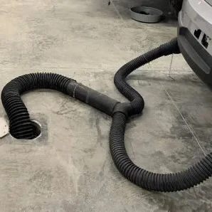 Self-Storing Underground Vehicle Exhaust Systems